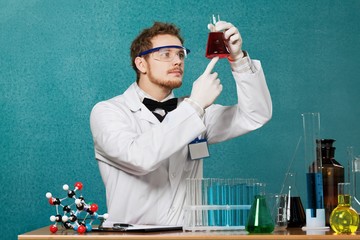 Wall Mural - Chemistry. Woman with test tubes in a chemistry lab