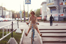 Cheerful Girl On A Bicycle Movement