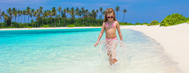 Sticker - Adorable little girl at beach during summer vacation