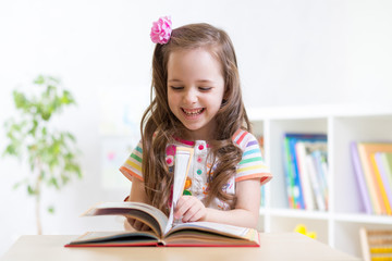 little student girl studying at preschool