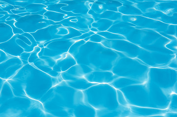 Bright water surface in swimming pool