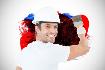 Poster - Composite image of portrait of happy man using paintbrush