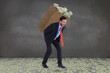 © WavebreakMediaMicro - Composite image of businessman carrying bag of dollars