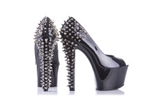 Pair Of Black High Heel Shoes With Spikes