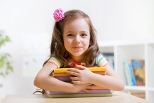 Cute Child Girl Preschooler With Books