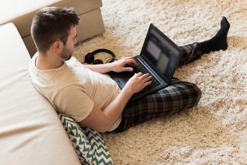 Man typing on laptop