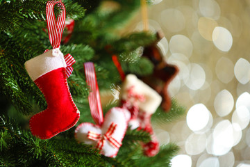 Wall Mural - Decorated Christmas tree on blurred, sparkling and fairy background