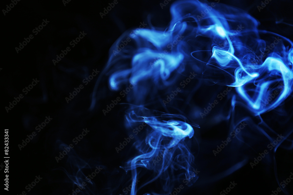 Color smoke from match on dark background
