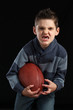 Boy Holding Football Missing Teeth