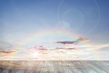 Old Wooden Texture And Rainbow With Lens Flare In Blue Sky