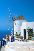 Old Traditional Windmill In Oia Village Of Santorini, Greece