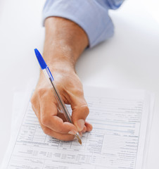 Wall Mural - man filling tax form