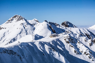 View on mountains and blue sky above clouds