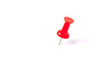 © sapgreen - close up of a red pushpin on white background