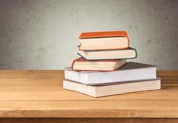 Sticker - Retro. Vintage old books on wooden deck table over grunge