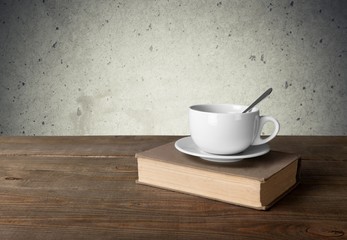 Poster - Tea. Cup of coffee and book on wooden table