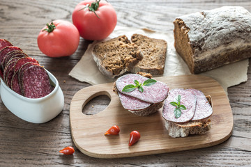 Wall Mural - Sandwiches with salami and tomatoes