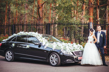 The Bride Near A Black Wedding Car
