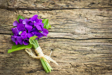 Beautiful Bouquet Of Violets On The Wooden Background