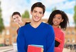© BillionPhotos.com - Students. Group of university students at the library smiling
