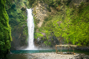 Waterfall in a mountain gorge, Philippines.