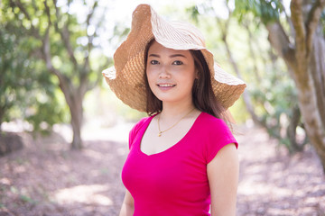 Asian women smiling and  happy  feeling in the garden