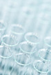 © ILYA AKINSHIN - Laboratory test tubes, abstract background