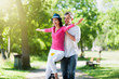 © jackfrog - A lovely couple is having fun on a unicycle in the park.