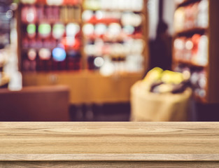 Poster - Empty wood table and blurred restaurant background. product disp