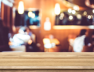 Leinwandbilder - Empty wood table and blurred restaurant background. product disp