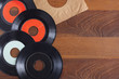 © VTT Studio - Record vinyl top view on wooden background