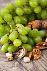 Poster - Assorted nuts with grapes.