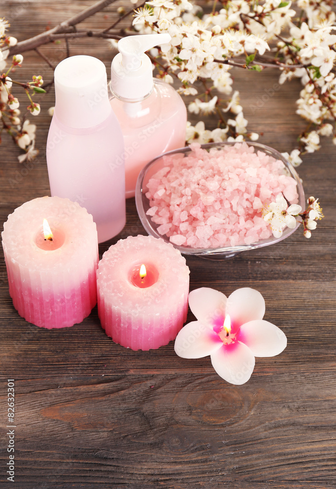Spa still life with flowering branches on wooden background