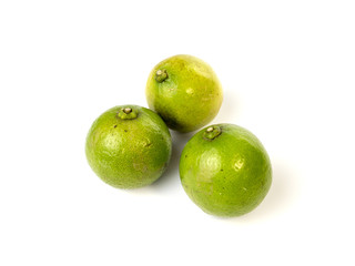 Green limes on white background