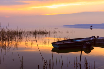 Sunset on the lake Balaton with a boat