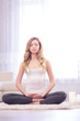 © Viacheslav Yakobchuk - Young woman doing yoga and meditating