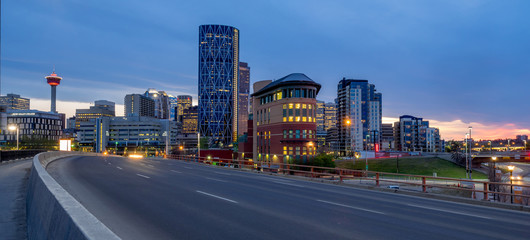 Calgary skyline at night with Bow River and freeway.