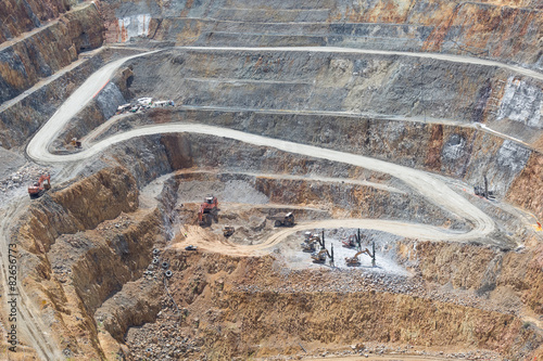 Fotografia, Obraz Bottom of open pit and machinery of a gold mine martha in Waihi,