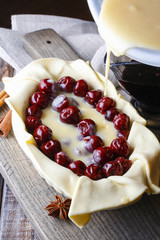 Sticker - French puff pastry with cherries before baking