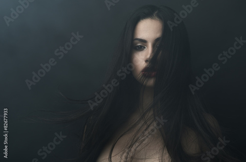 Fotografering mysterious portrait of a girl in dark fog