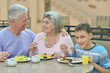 © aletia2011 - Grandparents with grandchild at breakfast