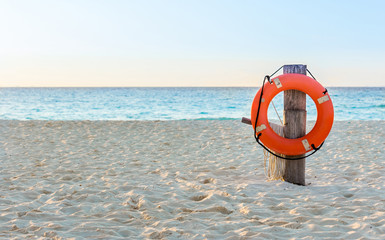 Wall Mural - Life preserver on sandy beach