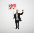 © ArtFamily - man holding placard with stop sign