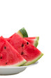 chopped watermelon on a plate on a white background