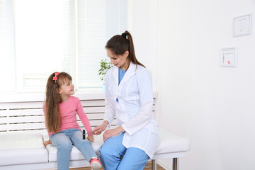 Poster - Little girl and young doctor in hospital