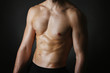 © Africa Studio - Muscle young man on black background
