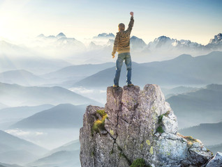 Wall Mural - winner on the mountain top. active life concept..