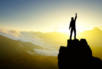 Wall Mural - winner on the mountain top. active life concept..
