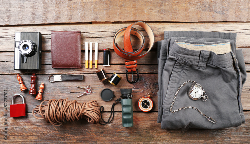 Hiking gear on wooden background