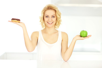 Canvas Print - Happy woman with donut and apple